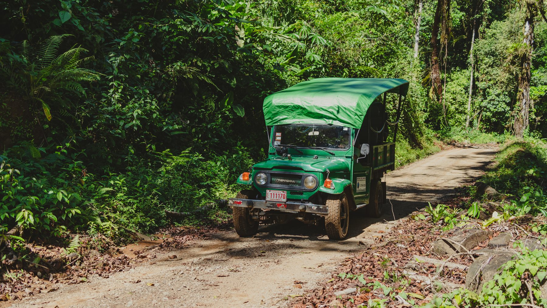 Brisas del Nara safari truck on a rural forest road